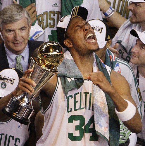 Boston Celtics forward Paul Pierce shouts as he holds the MVP trophy as the Boston Celtics celebrate their 131-92 win over the Los Angeles Lakers to win the NBA basketball Championship in Boston, Tuesday, June 17, 2008. (AP Photo/Charles Krupa)