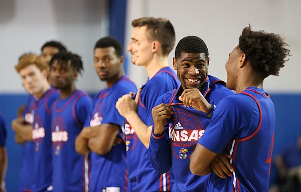 Blue Team guard Malik Newman laughs with teammate Devonte Graham before a scrimmage on Wednesday, June 7, 2017 at the Horejsi Family Athletics Center.