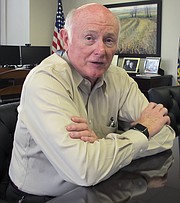 In this June 28, 2017 photo, Kansas Revenue Secretary Sam Williams answers questions about tax issues during an interview in his Topeka office.