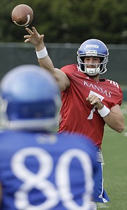 Kansas junior quarterback Peyton Bender unleashes a pass during a preseason practice on Monday, Aug. 7, 2017.