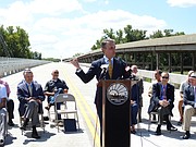 Lt. Gov. Jeff Colyer speaks in Shawnee County to dedicate a rural bridge across the Kansas River. Colyer has been appearing in public more since Gov. Sam Brownback announced he will soon step down, but he carefully avoids discussing policy issues while Brownback is still in office.