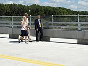 Lt. Gov. Jeff Colyer, right, who is primed to take over as governor in a matter of weeks, walks across a new rural bridge over the Kansas River west of Topeka with his spokeswoman Kara Fullmer and special assistant Clay Barker. Colyer helped dedicate the new bridge Monday while carefully avoiding any questions about state policy.
