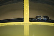 A pair of sunglasses sit on top of the dash of a Piper Cherokee 140 on Tuesday, Aug. 29, 2017 at the Vinland Valley Aerodrome.