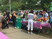 Festivalgoers stop by the Islamic Center of Lawrence's booth for traditional Middle Eastern dishes of basbousa and baklava, which were fan favorites, as well as beef pastries and shawarma.