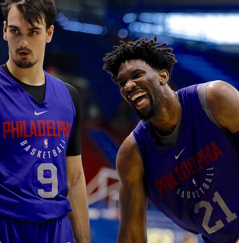 Former Kansas center Joel Embiid laughs while working with Philadelphia teammate Dario Saric in Allen Fieldhouse on Thursday, Oct. 12, 2017, during a Sixers practice.
