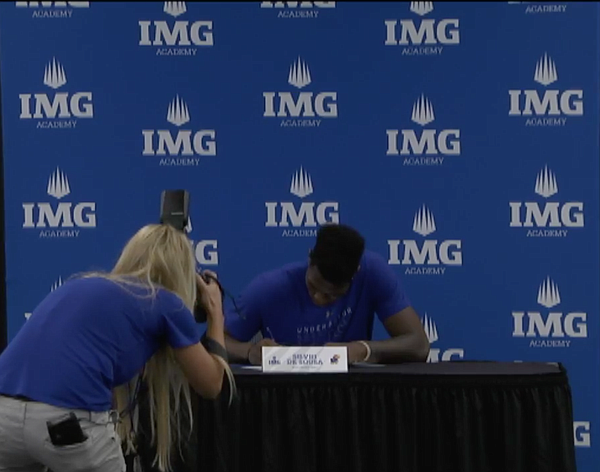 Future KU forward Silvio De Sousa makes his commitment to Kansas official by signing his national letter of intent at IMG Academy on Wednesday, Nov. 8, 2017. (Photo from IMG Facebook live stream of the event) 