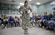 Brennah Wahweotten, a junior at Haskell Indian Nations University, from Mayetta, and a Prairie Band Potawatomi member, demonstrates a women’s jingle dance in her traditional regalia during Share Southwest activities at Southwest Middle School Wednesday, Nov. 15. The event was a collaboration between Haskell students and the SWMS Native Club.