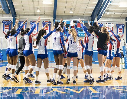 The Kansas volleyball team breaks its huddle after a five-set loss to West Virginia on Saturday, Nov. 25, 2017 at Horejsi Family Athletics Center.