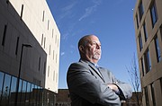 Bob Augelli, a lecturer in the School of Business and program director for the multicultural business scholars program. Augelli is pictured outside Capitol Federal Hall on the KU campus on Thursday, Nov. 30, 2017.