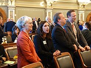 Sen. Marci Francisco, left, D-Lawrence, Rep. Eileen Horn, D-Lawrence, Sen. Tom Holland, D-Baldwin City, and Rep. Tim Hodge, D-Newton, talk among themselves while waiting for the start of Gov. Sam Brownback's 2018 State of the State address.