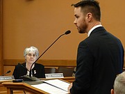 Sen. Marci Francisco, D-Lawrence, listens as Lawrence, an assistant to the Lawrence City Manager, briefs the Senate Utilities Committee Thursday about the city's decision to dispose of nitrate-contaminated water from the former Farmland Industries fertilizer plant into the Kansas River.