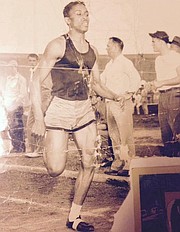 Leonard Monroe, pictured here as a young man, was the second-fastest quarter-mile runner in the state of Kansas while attending Lawrence High School. Monroe, who graduated in 1950, dreamed of running at the University of Kansas — until the team&squot;s head coach told him he&squot;d "never" be allowed because of his skin color.
