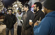 Topeka residents Charlie Gaito, left, Patrick Abbott, Ivan Bermudez, Jeremiah Brannan and Alex Stovall, who all say that they travel to Lawrence for food and entertainment, give their opinions about safety in Lawrence, Thursday, Jan. 18, 2018 along the 1000 block of Massachusetts Street.