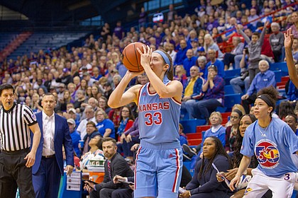 Kansas guard Kylee Kopatich (33) sets up for a 3-pointer late in the fourth quarter Sunday against Kansas State at Allen Fieldhouse.