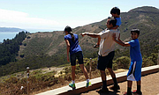 Lawrence father Syed Jamal, pictured here with his children, was arrested last week and is now facing deportation after more than 30 years living in the U.S. In this photo, the research scientist enjoys a lighthearted moment with his daughter, Naheen, and sons Fareed (on shoulders) and Taseen, during a family vacation in California.