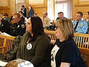Heather Joyce, left, and Theresa Wynne, the sister-in-law and mother respectively of Dominique White, who was shot and killed by Topeka police officers in September, listen Tuesday, Feb. 13, 2018 during testimony in a Senate committee on a bill that would require law enforcement to provide public access to police camera audio and video in certain circumstances.