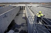 Melinda Harger, utilities engineer with the City of Lawrence, stands above the Biological Nutrient Removal basin at the new Wakarusa Wastewater Treatment Plant, 2300 E. 41st St., Tuesday, Feb. 13, 2018.