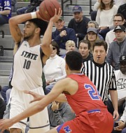 High school basketball official Josh Roberts watches the play during Saturday's game between Free State and Bishop Miege at FSHS.