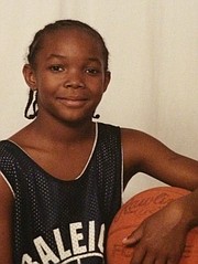 KU senior Devonte’ Graham, shown here at 8 years old in his Roberts Park Community Center team jersey in Raleigh, N.C., developed as a leader on the basketball court from an early age.