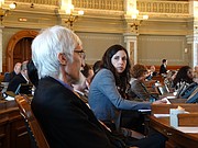 Reps. Boog Highberger and Eileen Horn, both Lawrence Democrats, listen during debate on the House floor on a bill to restore teacher tenure rights that lawmakers repealed in 2014.