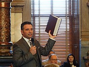 Sen. Ty Masterson, R-Andover, holds a volume of the annotated U.S. Constitution as he argues in favor of calling a "convention of the states" to propose amendments reining in the power of the federal government.