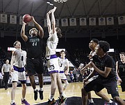 Free State senior Jalan Robinson (44) scores during the 6A state championship game against Blue Valley Northwest on Saturday, March 10, 2018 at Charles Koch Arena in Wichita.
