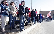 Parents and community members gather around Lawrence High School, Wednesday, March 14, 2018, to show support for students who walked out of class as part of a national protest against gun violence.