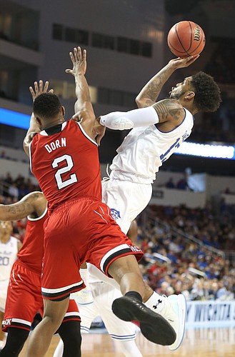 Seton Hall guard Myles Powell puts up a shot against North Carolina State guard Torin Dorn (2) during the second half, Thursday, March 15, 2018 at Intrust Bank Arena in Wichita, Kan.
