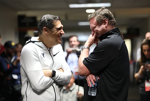 Villanova head coach Jay Wright, left, and Kansas head coach Bill Self have a laugh in the hallway while waiting to do a joint CBS interview on Thursday, March 29, 2018 at the Alamodome in San Antonio.