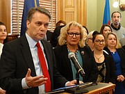 Gov. Jeff Colyer and Department for Children and Families Secretary Gina Meier-Hummel announce new efforts to collect past-due child support from noncustodial parents.