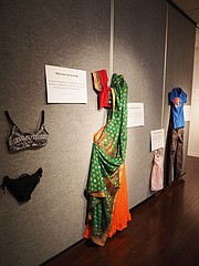 Outfits from the "What Were You Wearing?" exhibit, pictured here, include everything from child-sized sundresses to a pair of cargo pants and a T-shirt. The installation, on display at the Kansas Union gallery through April 27, re-creates the outfits sexual-assault victims were wearing during their attacks.