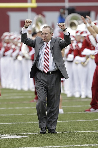 In this photo taken Sept. 6, 2014, former Arkansas athletic director Jeff Long walks onto the field before an NCAA college football game in Fayetteville, Ark. Long was announced as the 11th athletic director at the University of Kansas on Thursday, July 5, 2018. 