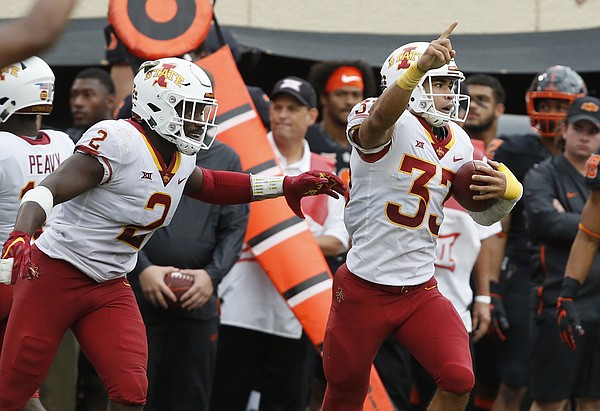  Iowa State defensive back Braxton Lewis (33) celebrates with teammate Willie Harvey (2) after an interception in the second half of an NCAA college football game against Oklahoma State in Stillwater, Okla., Saturday, Oct. 6, 2018. (AP Photo/Sue Ogrocki)