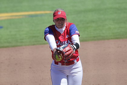 Kansas sophomore pitcher Hannah Todd winds up to throw in a game against Oklahoma, April 14, 2019, at Arrocha Ballpark.