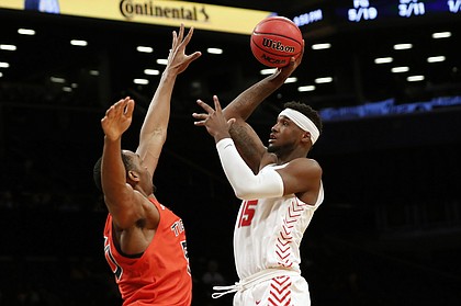 New Mexico forward Carlton Bragg Jr. (15) shoots with Auburn center Austin Wiley (50) defending during the first half of an NCAA college basketball game in the Legends Classic, Monday, Nov. 25, 2019, in New York. (AP Photo/Kathy Willens)