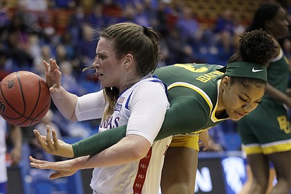 Kansas center Bailey Helgren, left, and Baylor guard Trinity Oliver (3) vie for a loose ball during the first half of an NCAA college basketball game in Lawrence, Kan., Wednesday, Jan. 15, 2020. (AP Photo/Orlin Wagner)