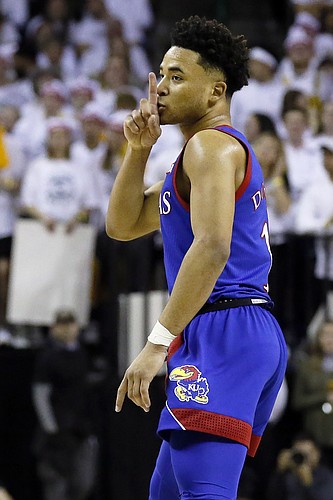 Kansas guard Devon Dotson gestures to the crowd after a three point basket against Baylor during the first half of an NCAA college basketball game on Saturday, Feb. 22, 2020, in Waco, Texas. (AP Photo/Ray Carlin)