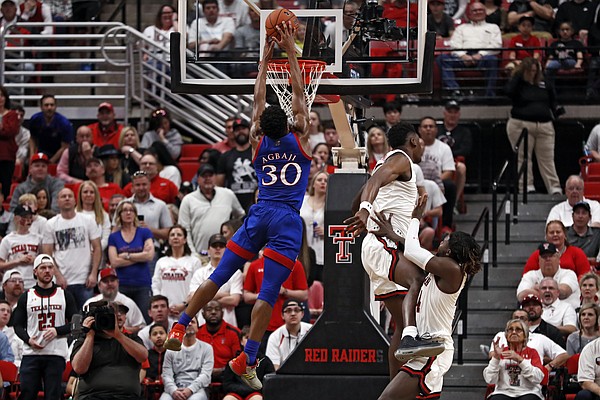 Kansas' Ochai Agbaji (30) tries to dunk the ball during the first half of an NCAA college basketball game against Texas Tech, Saturday, March 7, 2020, in Lubbock, Texas. (AP Photo/Brad Tollefson)