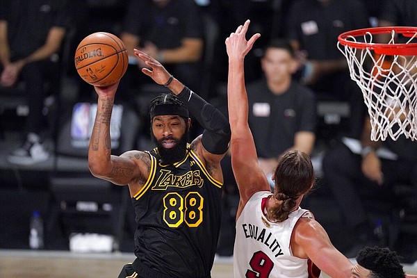 Los Angeles Lakers forward Markieff Morris (88) makes a pass in front of Miami Heat's Kelly Olynyk (9) during the first half of Game 2 of basketball's NBA Finals, Friday, Oct. 2, 2020, in Lake Buena Vista, Fla. (AP Photo/Mark J. Terrill)


