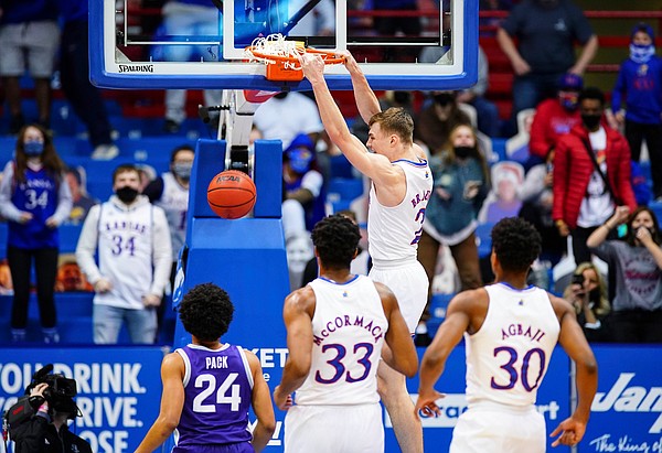 Kansas guard Christian Braun (2) delivers a dunk after a steal during the first half on Tuesday, Feb. 2, 2021 at Allen Fieldhouse.