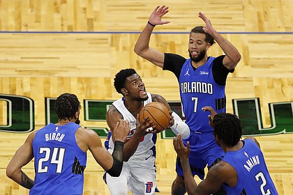 Detroit Pistons guard Josh Jackson (20) tries to score as Orlando Magic forward Al-Farouq Aminu (2), guard Michael Carter-Williams (7), and center Khem Birch (24) defend in the first half during an NBA basketball game, Sunday, Feb. 21, 2021, in Orlando, Fla. (AP Photo/Joe Skipper)