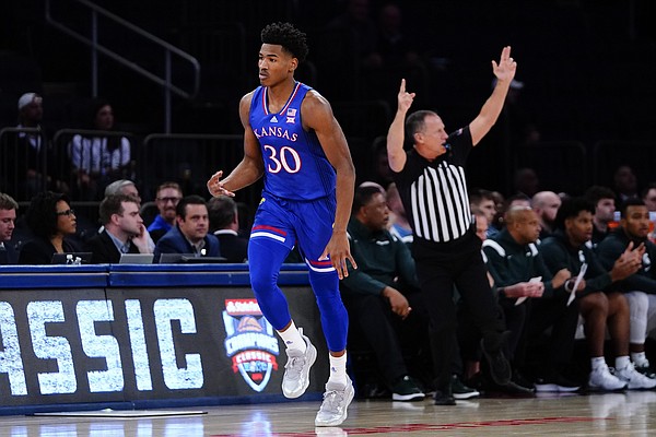 Kansas' Ochai Agbaji (30) gestures after making a three point shot during the first half of an NCAA basketball game against Michigan State Tuesday, Nov. 9, 2021, in New York. (AP Photo/Frank Franklin II)