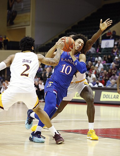 Iona guard Elijah Joiner, left, and forward Nelly Junior Joseph, right defend against Kansas forward Jalen Wilson during the second half of an NCAA college basketball game Sunday, Nov. 28, 2021, in Lake Buena Vista, Fla. (AP Photo/Jacob M. Langston)


