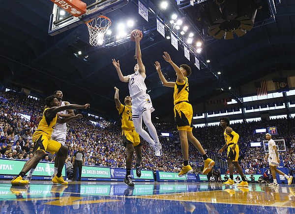 Kansas guard Christian Braun (2) goes in to the bucket during the second half against Missouri on Saturday, Dec. 11, 2021, at Allen Fieldhouse.