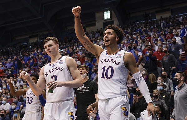 Kansas forward Jalen Wilson (10) looks for a foul while celebrating a bucket by the Jayhawks with Kansas guard Christian Braun (2) during the second half on Saturday, Jan. 15, 2022 at Allen Fieldhouse.