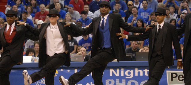 Kansas University senior basketball players, from left, Rodrick Stewart, Brad Witherspoon, Darnell Jackson and Jeremy Case dance as Russell Robinson sings "New York, New York." The Jayhawks performed the skit Friday at the 2007 Late Night in the Phog in Allen Fieldhouse. 