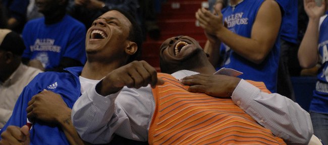 Kansas University guards Brandon Rush, left, and Sherron Collins bust out laughing while watching fellow guard Rodrick Stewart stumble after a tomahawk dunk in the second half of KU's 92-60 rout of Washburn. Rush made his season debut Thursday at Allen Fieldhouse, while Collins sat out his first game after undergoing foot surgery.