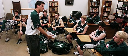 Barstow head coach Jeff Boschee, a former standout at Kansas University, gets after his team in the locker room during halftime of the Barstow School's 64-33 victory over Seabury Academy. Boschee is in his first year as head coach of the Knights.