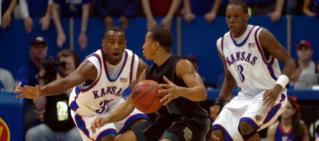 Kansas defenders Darnell Jackson, left, and Russell Robinson close in on Baylor guard Curtis Jerrells during Baylor's trip to Allen Fieldhouse in February of 2006. The Jayhawks defeated the Bears, 76-61. The teams will meet again tonight in the fieldhouse.
