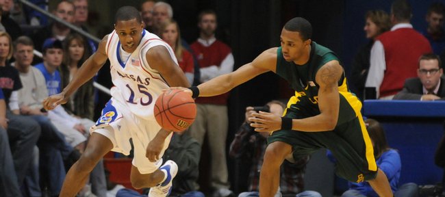 Kansas' Mario Chalmers and Baylor's Henry Dugat race for possession of the ball on Saturday at Allen Fieldhouse.